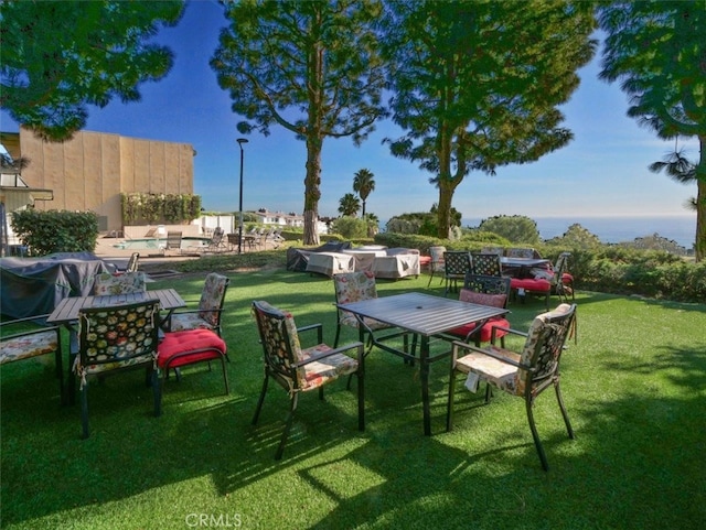 view of yard featuring outdoor dining space