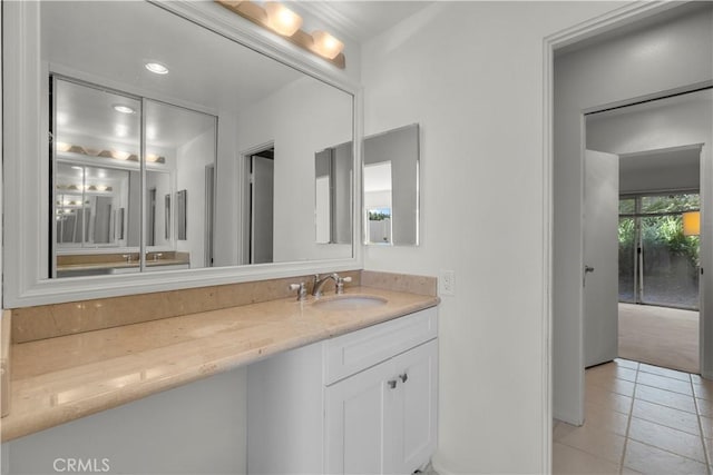 bathroom featuring tile patterned floors and vanity