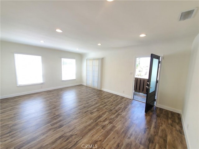 1741 Glenwood Rd, Glendale, CA 91201 - empty room featuring healthy amount of natural light, dark wood-style flooring, recessed lighting, and baseboards