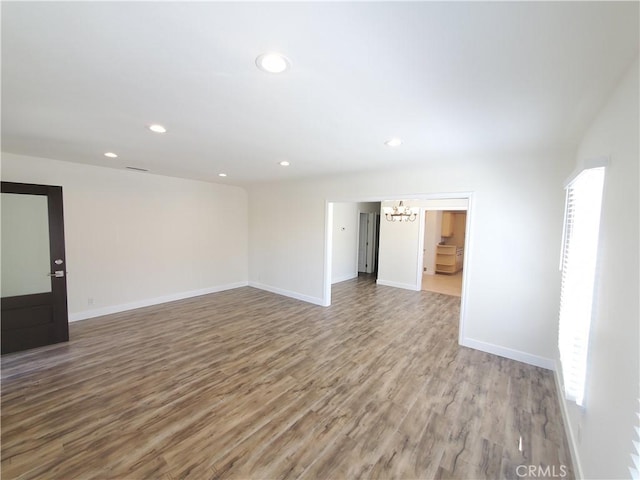 1741 Glenwood Rd, Glendale, CA 91201 - spare room featuring a chandelier, wood finished floors, recessed lighting, and baseboards