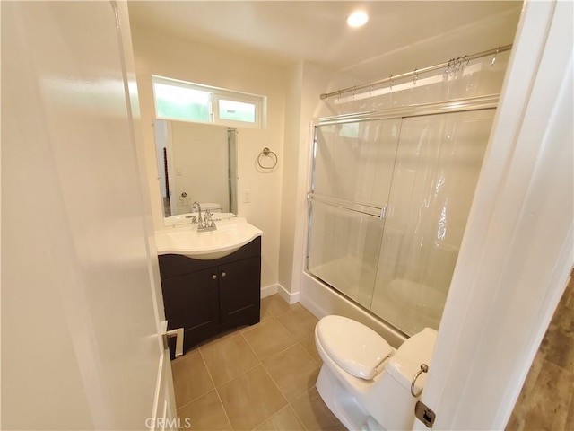1741 Glenwood Rd, Glendale, CA 91201 - bathroom with toilet, vanity, tile patterned flooring, combined bath / shower with glass door, and baseboards