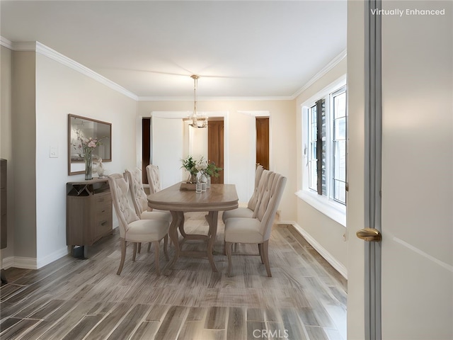 1741 Glenwood Rd, Glendale, CA 91201 - dining room featuring wood finished floors, ornamental molding, baseboards, and a chandelier