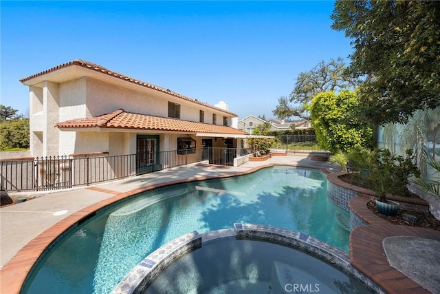 112 Morgan Ranch Rd, Glendora, CA 91741 - rear view of house with a fenced backyard, stucco siding, a patio area, a tiled roof, and a pool with connected hot tub