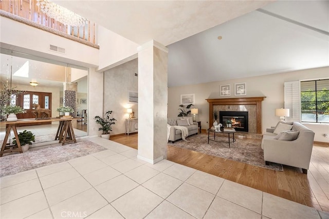 112 Morgan Ranch Rd, Glendora, CA 91741 - living room featuring tile patterned flooring, high vaulted ceiling, a premium fireplace, and baseboards