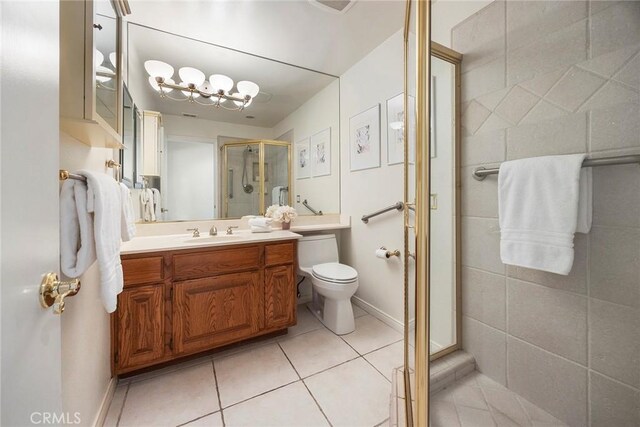 112 Morgan Ranch Rd, Glendora, CA 91741 - full bath with tile patterned flooring, a shower stall, vanity, toilet, and an inviting chandelier