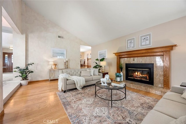 112 Morgan Ranch Rd, Glendora, CA 91741 - living room with high vaulted ceiling, visible vents, wood finished floors, and a fireplace