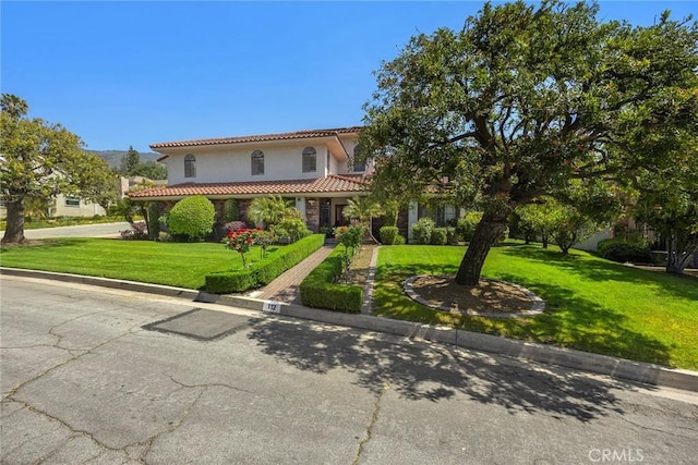 112 Morgan Ranch Rd, Glendora, CA 91741 - mediterranean / spanish house with a tiled roof, stucco siding, and a front lawn