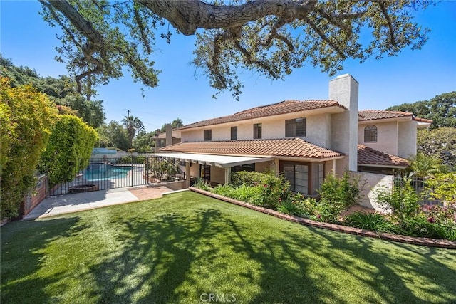 112 Morgan Ranch Rd, Glendora, CA 91741 - back of property with a chimney, a tile roof, a lawn, fence, and stucco siding