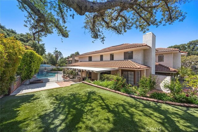 112 Morgan Ranch Rd, Glendora, CA 91741 - back of house with a chimney, a tile roof, stucco siding, and a patio area