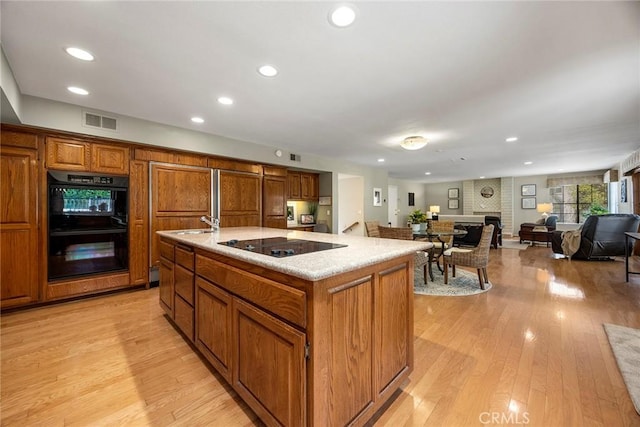 112 Morgan Ranch Rd, Glendora, CA 91741 - kitchen featuring recessed lighting, brown cabinets, and black appliances