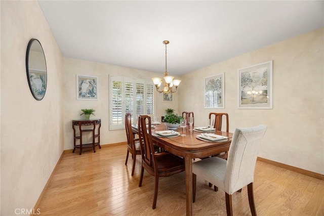 112 Morgan Ranch Rd, Glendora, CA 91741 - dining area with baseboards, an inviting chandelier, and light wood-style floors