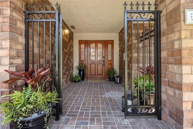 112 Morgan Ranch Rd, Glendora, CA 91741 - view of exterior entry with a gate and brick siding