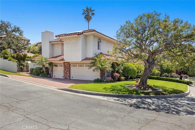112 Morgan Ranch Rd, Glendora, CA 91741 - view of front of property featuring a front yard, a chimney, a tiled roof, an attached garage, and driveway