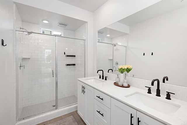 10456 Newbliss Way, Mira Mesa, CA 92126 - bathroom featuring a shower stall, double vanity, and tile patterned floors