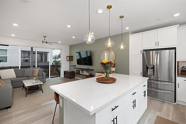 10456 Newbliss Way, Mira Mesa, CA 92126 - kitchen with stainless steel fridge with ice dispenser, open floor plan, a kitchen island, light wood-style flooring, and a ceiling fan