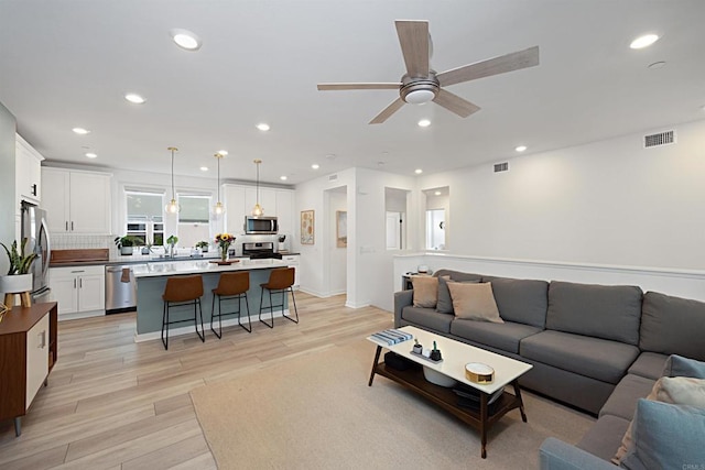10456 Newbliss Way, Mira Mesa, CA 92126 - living area with light wood-style flooring, a ceiling fan, and recessed lighting