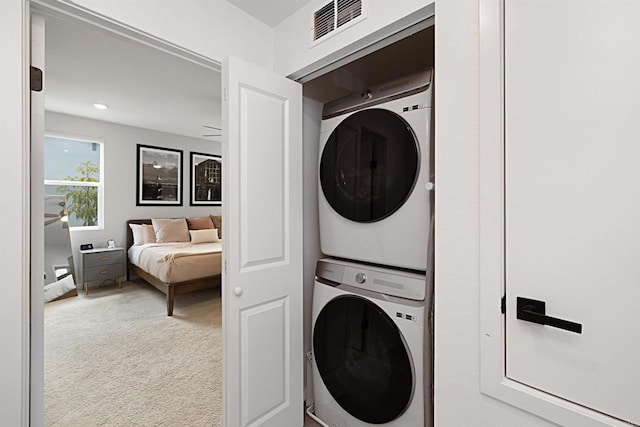 10456 Newbliss Way, Mira Mesa, CA 92126 - laundry room with stacked washing machine and dryer and carpet