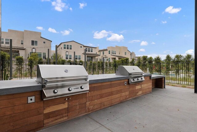10456 Newbliss Way, Mira Mesa, CA 92126 - view of patio featuring grilling area, exterior kitchen, and fence