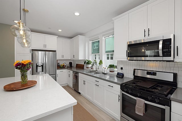 10456 Newbliss Way, Mira Mesa, CA 92126 - kitchen featuring appliances with stainless steel finishes, a sink, white cabinetry, backsplash, and recessed lighting