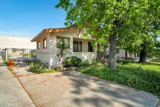 view of front of house with fence and a gate