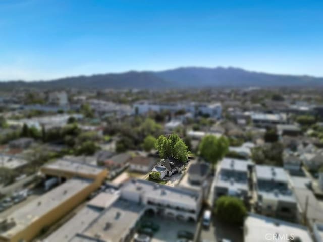 drone / aerial view featuring a mountain view