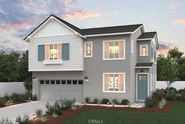 view of front of home featuring fence, stucco siding, driveway, and a garage