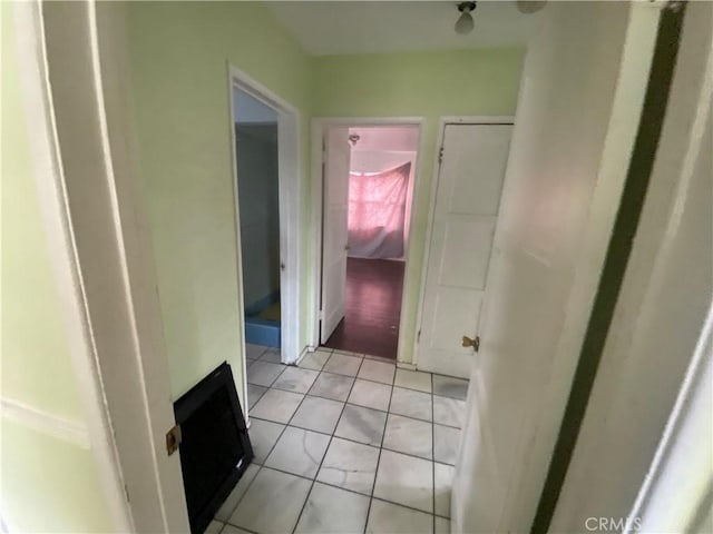 hallway featuring light tile patterned floors