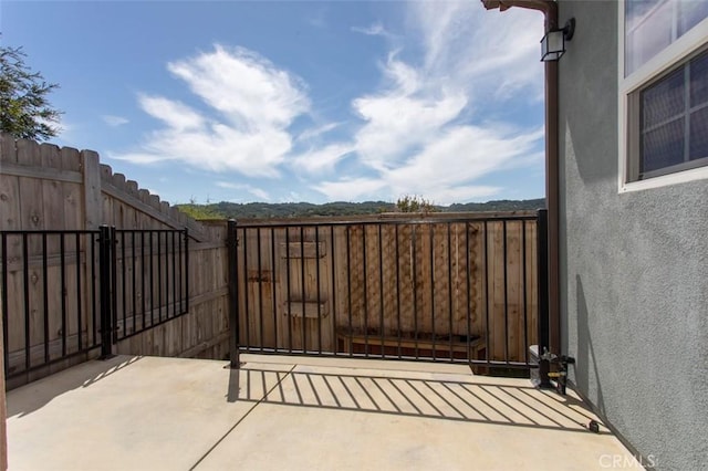 view of gate featuring fence