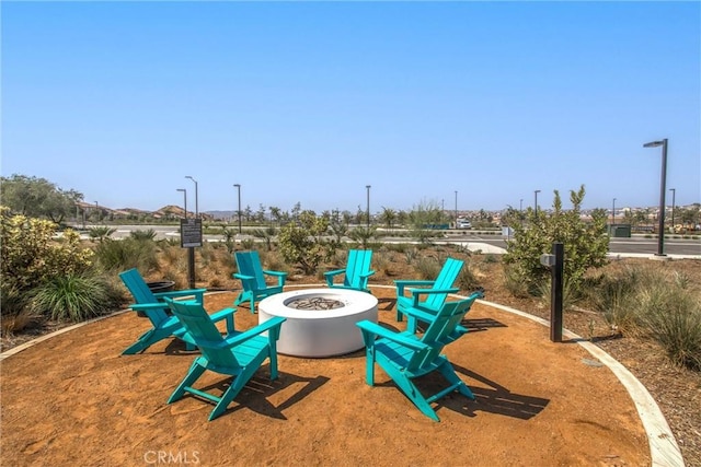 view of play area featuring an outdoor fire pit