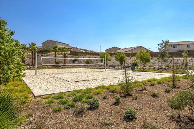 view of home's community featuring volleyball court