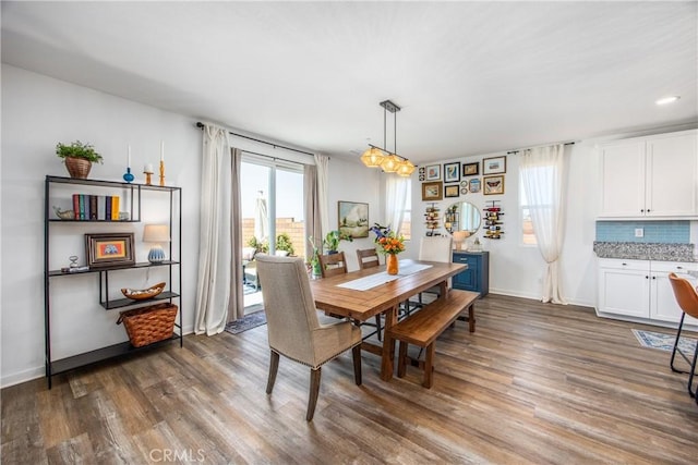 dining room featuring recessed lighting, baseboards, and dark wood-type flooring
