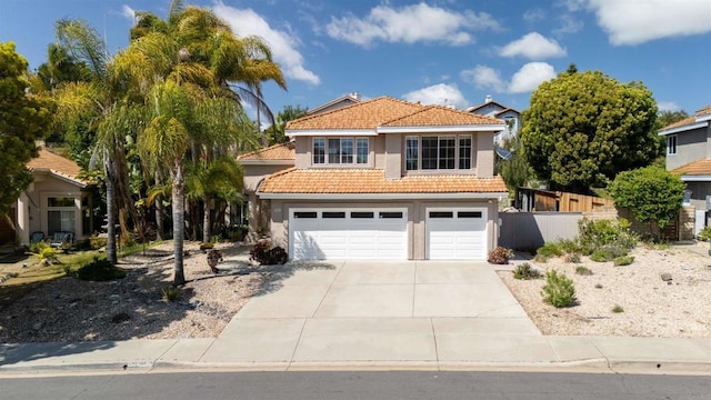 1366 Via Cibola, Oceanside, CA 92057 - mediterranean / spanish house with fence, a tile roof, a garage, stucco siding, and driveway