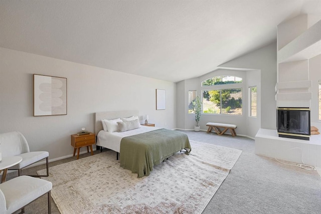 1366 Via Cibola, Oceanside, CA 92057 - bedroom featuring baseboards, carpet flooring, a glass covered fireplace, and vaulted ceiling