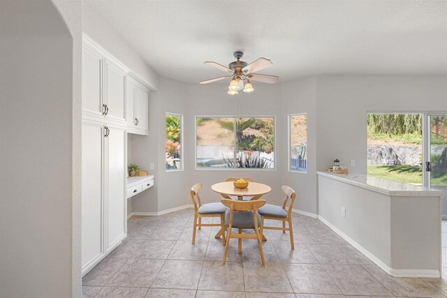 1366 Via Cibola, Oceanside, CA 92057 - dining space with baseboards, a ceiling fan, light tile patterned flooring, and a healthy amount of sunlight