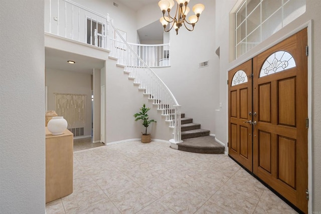1366 Via Cibola, Oceanside, CA 92057 - entrance foyer with light tile patterned flooring, a high ceiling, a notable chandelier, stairs, and visible vents