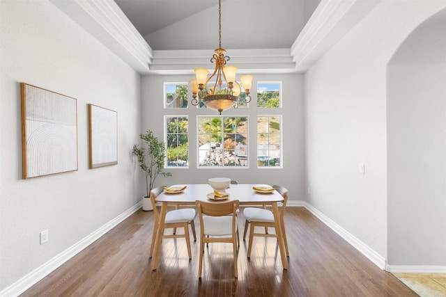 1366 Via Cibola, Oceanside, CA 92057 - dining space with wood finished floors, baseboards, a raised ceiling, arched walkways, and a notable chandelier