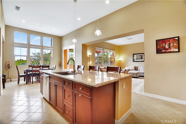 232 Village Commons Blvd Unit 21, Camarillo, CA 93012 - kitchen with light tile patterned floors, dishwasher, light stone countertops, hanging light fixtures, and recessed lighting