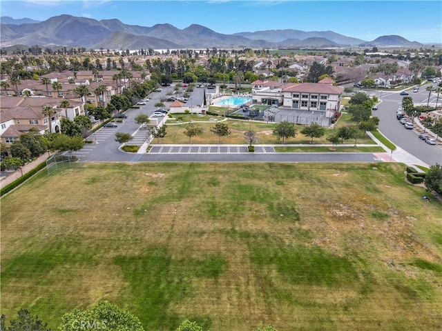 birds eye view of property with a mountain view and a residential view