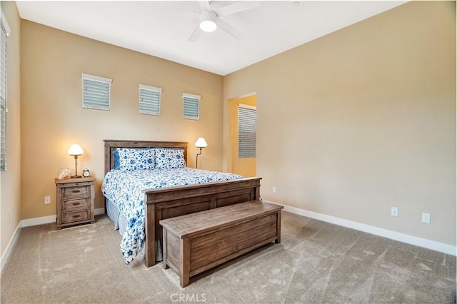 bedroom featuring carpet floors, baseboards, and a ceiling fan