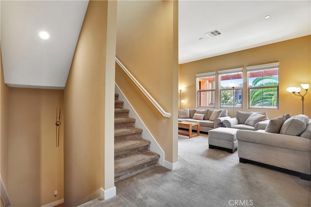 stairway with visible vents, carpet flooring, baseboards, and recessed lighting