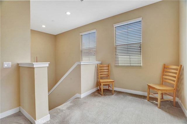 living area with baseboards, recessed lighting, carpet floors, and an upstairs landing