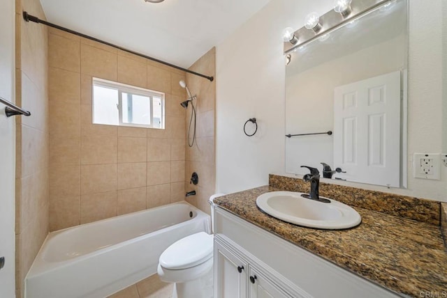 bathroom featuring vanity, tub / shower combination, and toilet