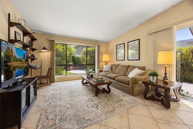 living area featuring plenty of natural light and light tile patterned flooring