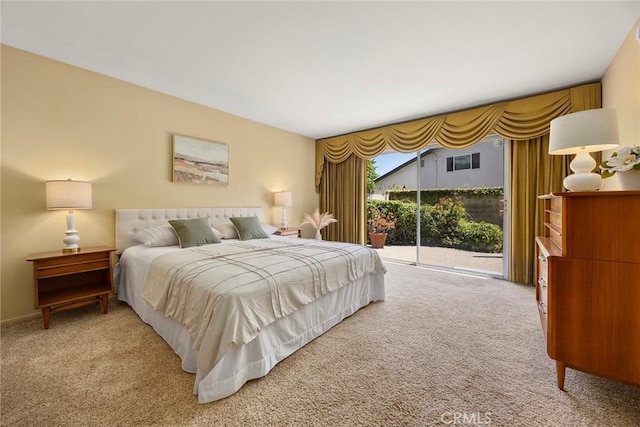 bedroom with carpet floors and access to outside