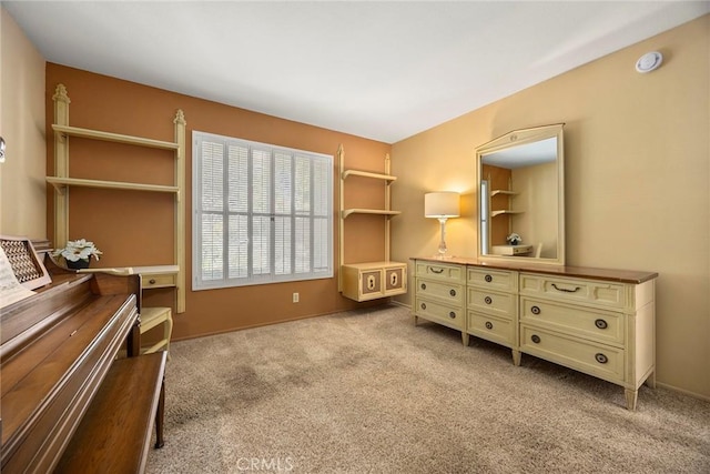living area featuring carpet floors and baseboards