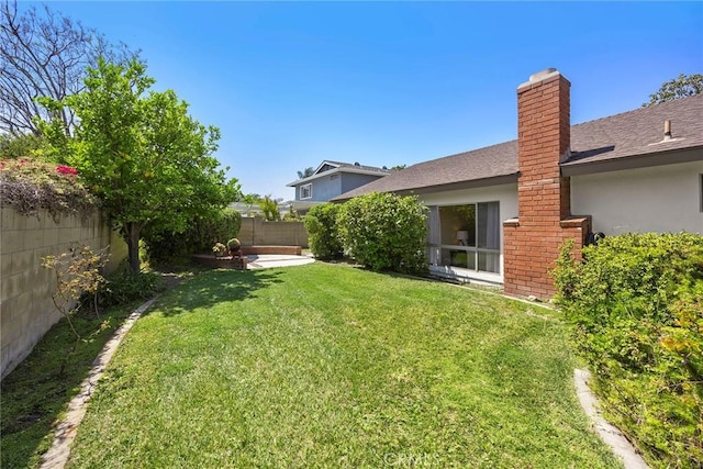 view of yard with a fenced backyard