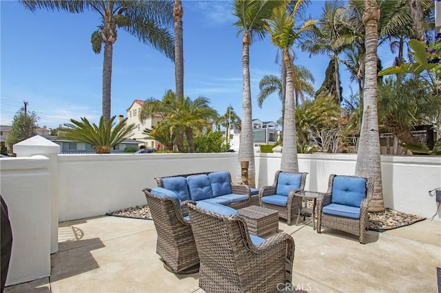 view of patio / terrace featuring an outdoor hangout area and fence private yard