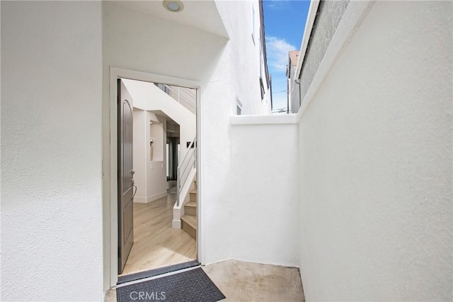 entrance to property featuring stucco siding
