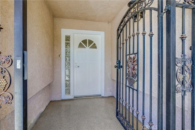 property entrance featuring stucco siding