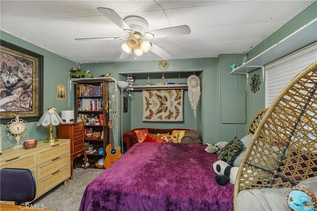 carpeted bedroom with a ceiling fan